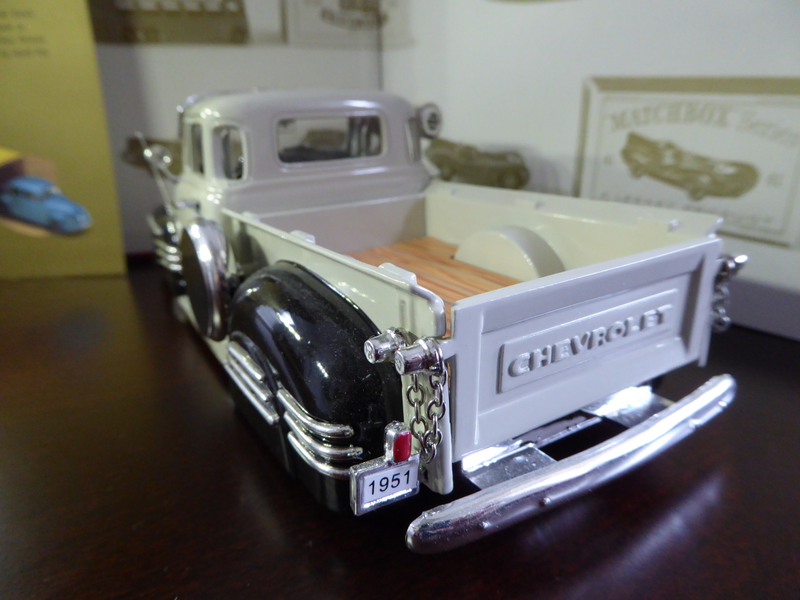 The license plate holder and bumper are separate parts. Only one rear light and is molded with the license plate holder.